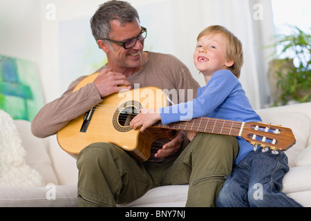 Father and son with guitar Stock Photo