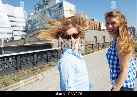 Women walking,  wind in their hair Stock Photo