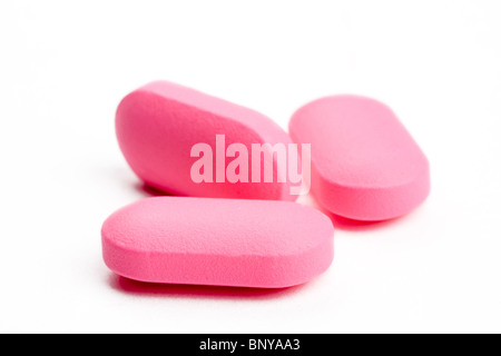 closeup of pink medical pills, isolated