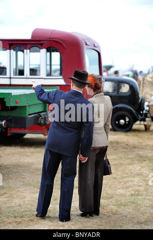 A couple in period civilian costumes in the WWII themed section of the Battle of Britain village at The Royal International Air Stock Photo