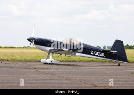 Avions Mundry CAP 232 G-OGBR  taxiing along runway at with Gerald Cooper at the controls at Wickenby Airfield Stock Photo