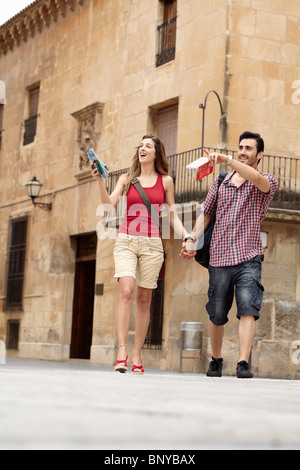 Tourist couple exploring town square Stock Photo