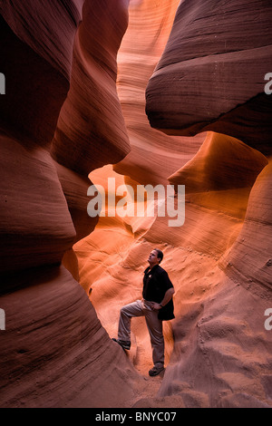 Self portrait of photographer Don Smith examining the beauty of Lower Antelope Canyon, Page, Arizona, USA. Stock Photo