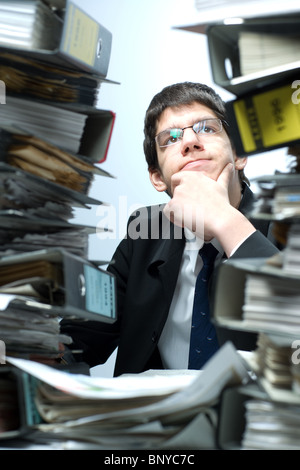 A man wondering about his tax declaration Stock Photo