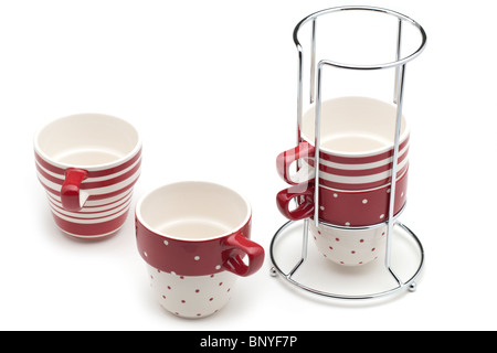 Red and white striped and spotted 4 cup metal framed mug stack Stock Photo