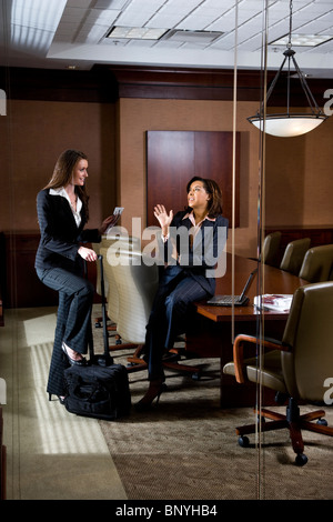 Two businesswomen in boardroom Stock Photo