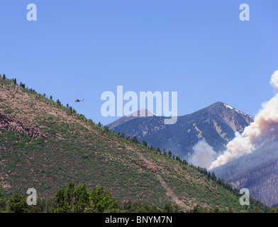 Flagstaff Arizona Schultz mountain forest fire June 2010 final day with helicopter control. Stock Photo