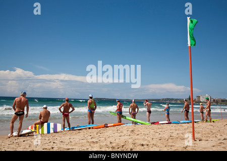 Surf Lifesavers await the start of a rescue board race.  Cronulla Beach, Sydney, New South Wales, AUSTRALIA Stock Photo