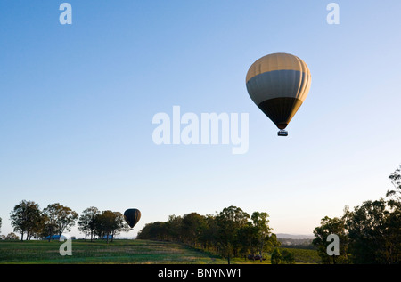 A hot air balloon takes off for a scenic flight over the vineyards. Hunter Valley, New South Wales, AUSTRALIA Stock Photo