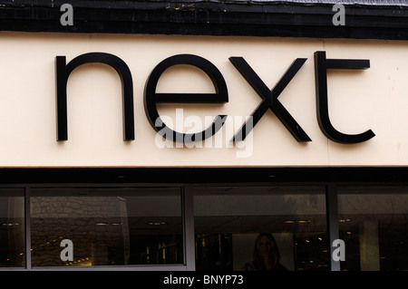 Next clothes shop sign logo, Cambridge, England, UK Stock Photo