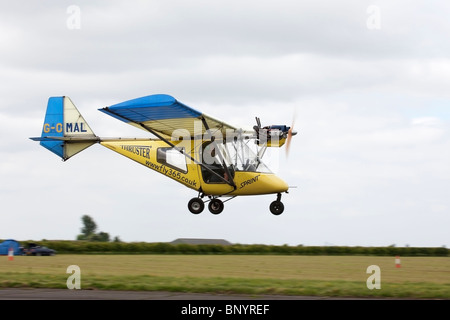 Thruster T600N 450 Sprint G-OMAL microlight aircraft on final approach to land at Wickenby Airfield Stock Photo