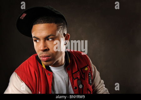 Portrait of young African American wearing baseball hat Stock Photo