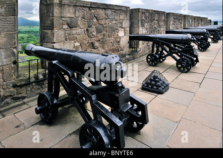 Cannons sticking their gun barrels through the gun embrasures at Stirling Castle, Scotland, UK Stock Photo