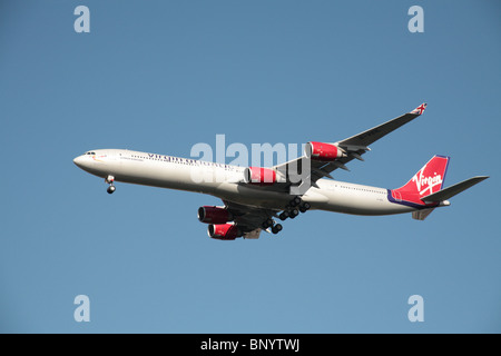Virgin Atlantic Airbus A340-600 on final approach to Heathrow Airport Stock Photo