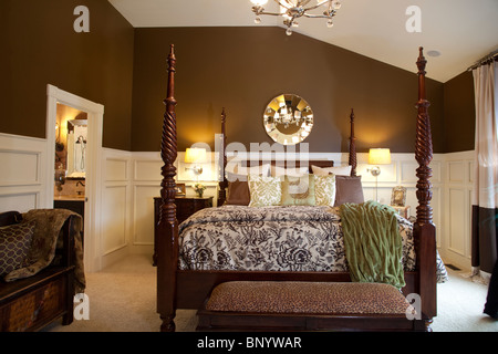 Beautiful arranged American master bedroom in cream and brown clolors Stock Photo