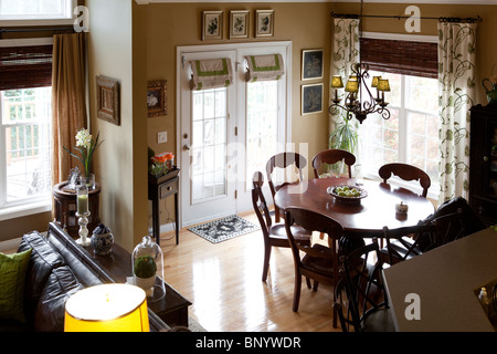 Family room with round wooden able and chairs. American Kitchen Stock Photo