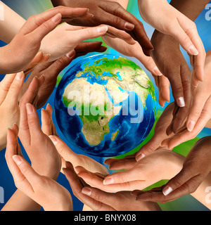 Beautiful conceptual symbol of the Earth globe with multiracial human hands around it. Unity and world peace concept. Stock Photo