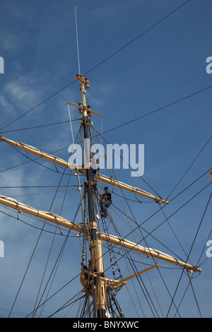 New young cadets entering the rig of the training ship Danmark in the port of Copenhagen prior to their training cruise. Stock Photo