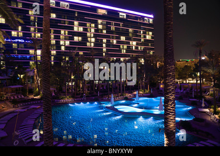 Hard Rock Hotel, Las Vegas USA - the swimming pool floodlit at night. Stock Photo