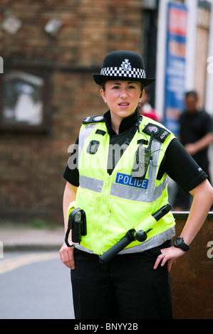 Front view of WPC woman police officer guarding a crime scene in ...