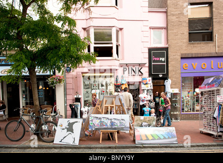 Shops in Bond Street, Brighton, with art work outside on display Stock Photo