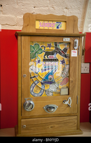 Penny slot machine in the Mechanical Memories Amusement Museum, Kings Road Arches, Brighton Stock Photo