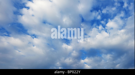 White cumulus clouds in the summer blue sky Stock Photo