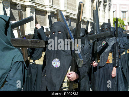 Black hooded members of a Brotherhood during the Semana Santa processions in Seville, southern Spain on April 6, 2004. Stock Photo