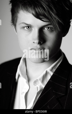 Portrait Shot of a Handsome Teenage Boy in Suit and Shirt Stock Photo