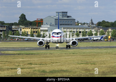 Sukhoi Superjet 100 taxiing out onto the runway at the Farnborough Airshow Stock Photo