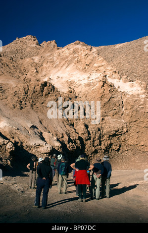 Tourists view eroded rock formations in the Valle de la Luna, Moon Valley, San Pedro de Atacama, Chile, South America. Stock Photo