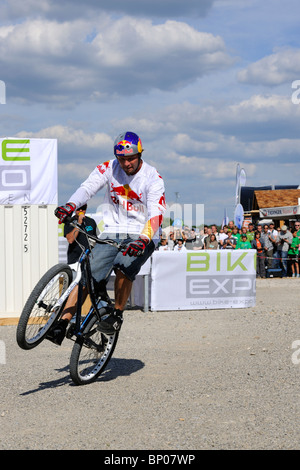 World Champion Trial Biker Petr Kraus at the Bike Expo in Munich showing some of his tricks. Stock Photo