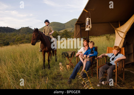 Kenya, Chyulu Hills, Ol Donyo Wuas. Family on a riding safari with Ride Africa in the Chyulu Hills. (MR) Stock Photo