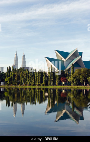 South East Asia, Malaysia, Kuala Lumpur, Petronas Towers and Istana Budaya National Theatre, Lake Titiwangsa Stock Photo