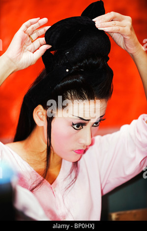 South East Asia, Malaysia, Penang, Georgetown, Taiwanese Chinese Opera, performers preparing makeup Stock Photo