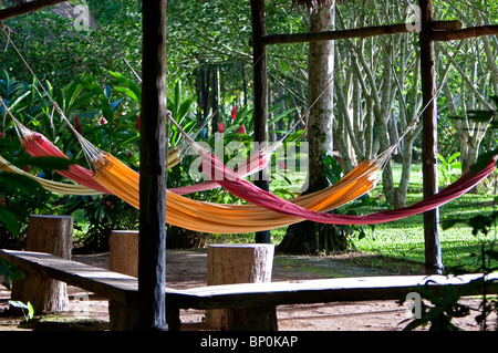 Peru. Colourful hammocks at Inkaterra Reserva Amazonica Lodge, situated on the banks of the Madre de Dios River. Stock Photo