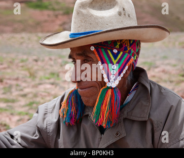 Peru. An indigenous Indian farmer wearing a two hats, to keep him warm in the biting cold at 15,000 feet. Stock Photo