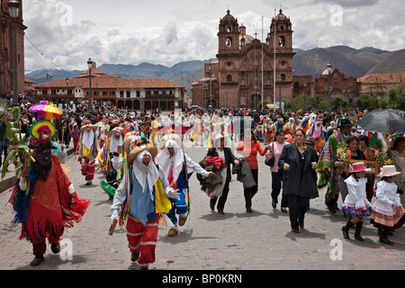 Peru, Masked dancers on Christmas Day in Cusco s square, Plaza de Armas, celebrating the Andean Baby Jesus, Nino Manuelito. Stock Photo