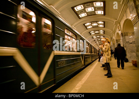 Russia, St. Petersburg; Inside one of the Metro Stations in the city whilst a metro enters Stock Photo