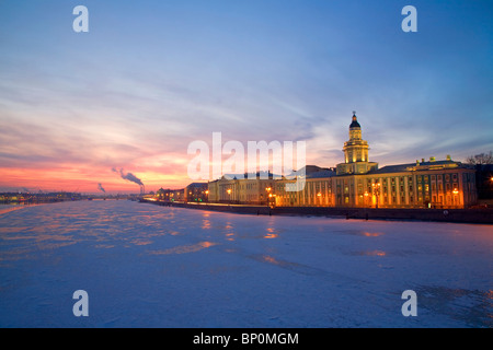 Russia, St. Petersburg; The last light over the partly frozen Neva River with the ‘Kunstkamera’ prominent in the foreground Stock Photo
