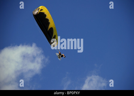 Powered parachute glider overhead. Stock Photo