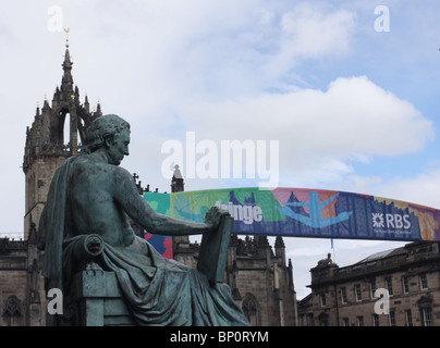 Statue of philospher David Hume on Royal mile with Edinburgh Fringe sign   Scotland August 2010 Stock Photo
