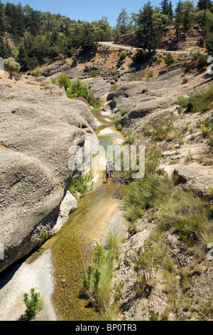 River vertical erosion through conglomerate rock beds, Rhodes, Greece Stock Photo