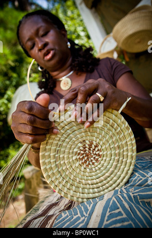 Barbara Manigault, a Gullah sweet grass basket weaver at her stand in Mt Pleasant, SC.  Stock Photo