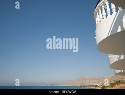 Coastal view with white balcony blue sky, Pefkos, Rhodes, Greece Stock Photo