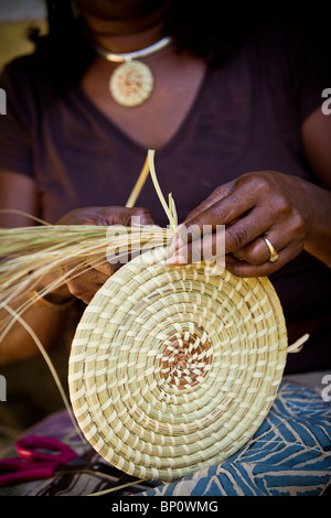 Barbara Manigault, a Gullah sweet grass basket weaver at her stand in Mt Pleasant, SC. Stock Photo