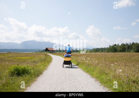 Men cycling with trailer Stock Photo