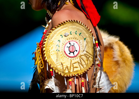 A young natives wearing Huron-Wendat traditional dresses and paint takes part into the dance contest of the Wendake Pow-Wow Stock Photo