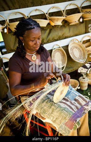 Barbara Manigault, a Gullah sweet grass basket weaver at her stand in Mt Pleasant, SC.  Stock Photo