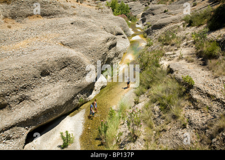 River vertical erosion through conglomerate rock beds, Rhodes, Greece Stock Photo